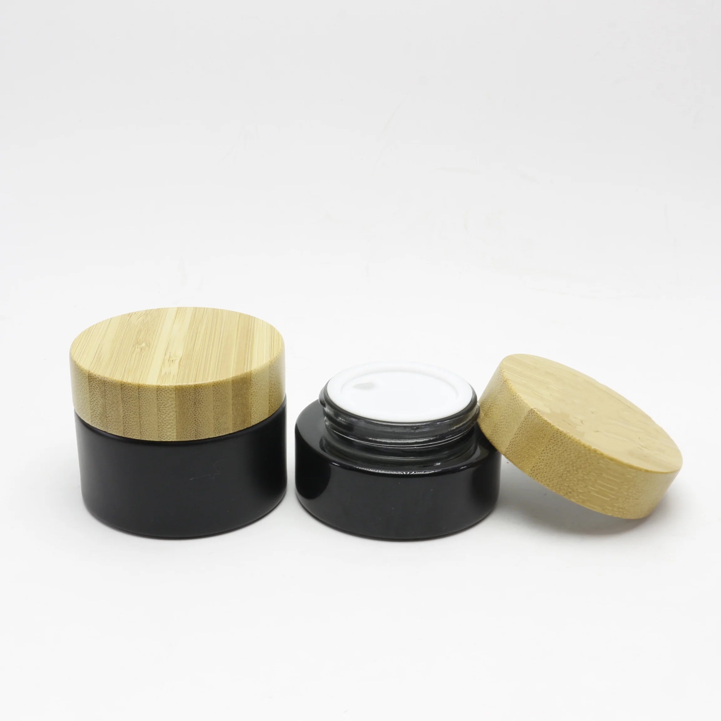 Cosmetic Hot Sale Packaging 1oz 30ml Black Little Fancy Bamboo Top Body Butters Frosted Glass Jars Wood Lid Glass Jars With Lids