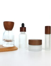 Luxury Cosmetic Perfume Packaging Glass Oil Bottle with Walnut Wood Ash Wood Cap for Skin Care Set Custom OEM