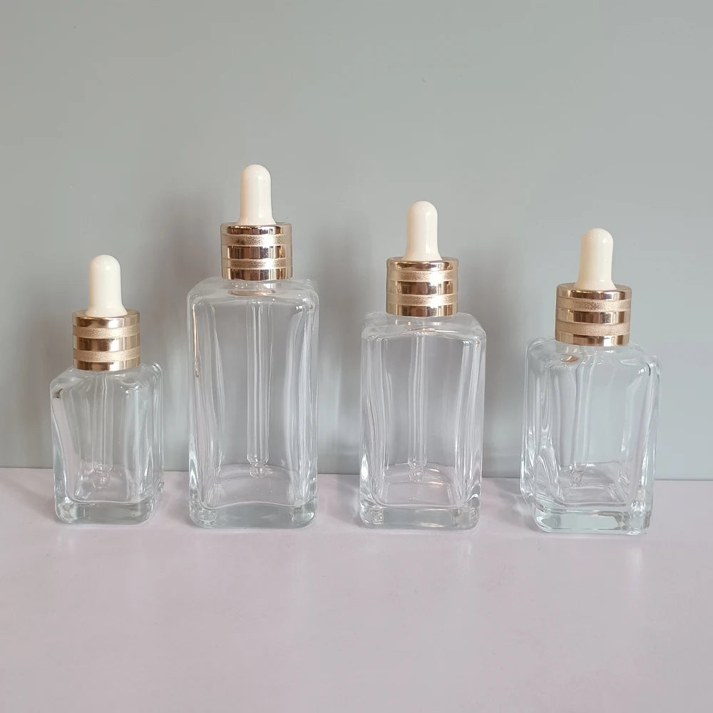 Luxury Transparent Square Dropper Bottle 30ml 50ml 75ml 100ml Cosmetic Glass Facial Serum Packaging Bottle for Essential Oil