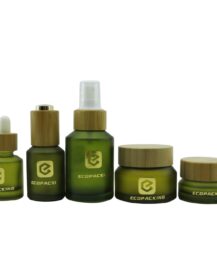 Luxury Cosmetic Slant Shoulder Empty Olive Green Lotion Face Cream Glass Jar Bottle Set with Bamboo Pump Dropper Spray Lid