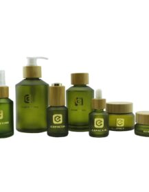 Hot Sale Frosted Glass Cosmetic Bottles Olive Green Slanted Shoulder Dropper Bottle Empty Glass Cream Jar with Bamboo Lid