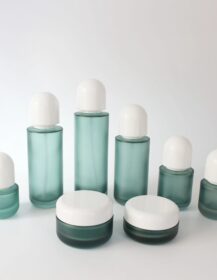 In Stock Skin Care Frosted Green Empty Glass Bottle and Jar Set for Essence Lotion Pump Spray Cosmetic Packaging