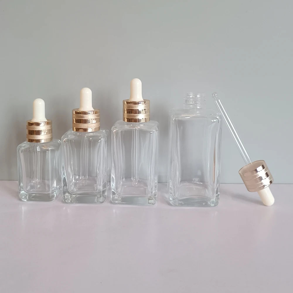 Square Luxury 30ml 50ml 75ml 100ml clear Glass Serum Bottles With Droppers and Gold Collar for Serum Essential Oil