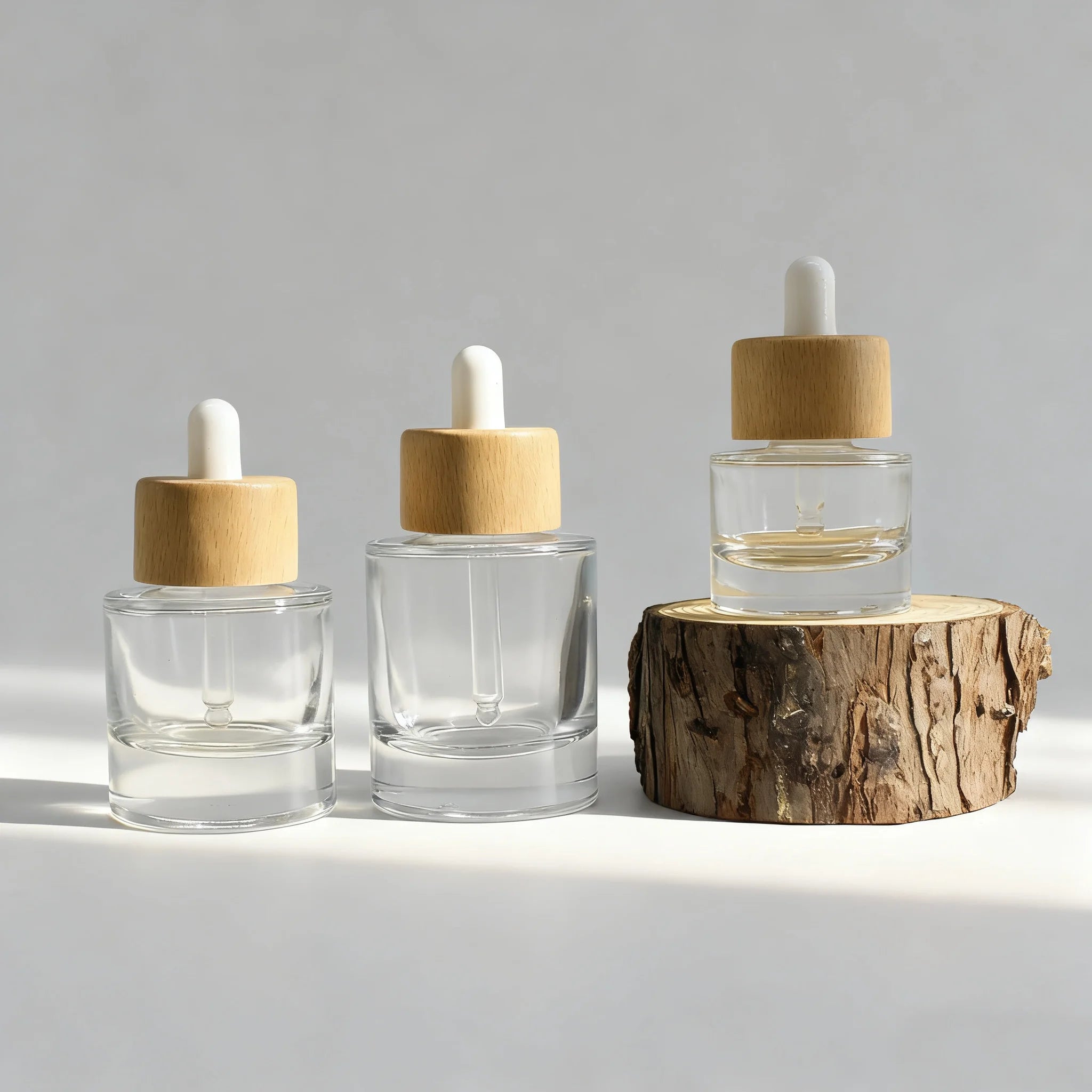 Cosmetic Thick Bottom 15ml 30ml 50ml Flat Shoulder Clear Glass Serum Dropper Bottle With Wood Lid