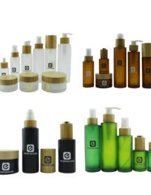 A Set of Frosted clear Amber Black Personal Skin Care Glass Dropper Bottles and Glass Jar with Bamboo Lid Wood